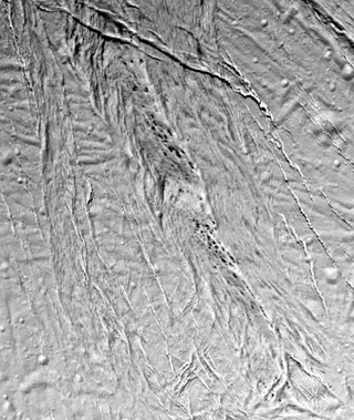 Illustration for article titled We Still Don't Understand These Spots on Saturn's Moon, and We're Not Going Back